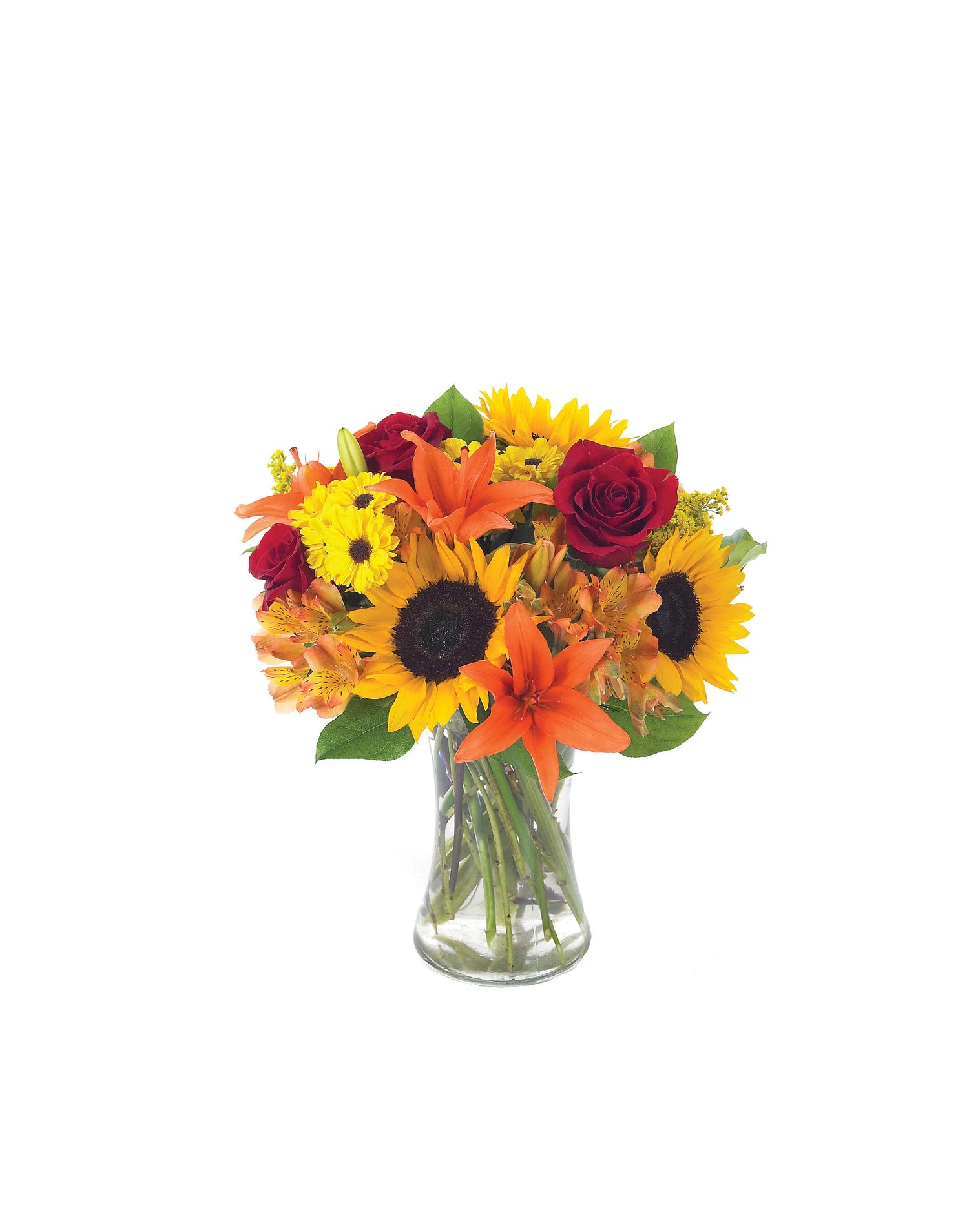 Bouquet of sunflowers, roses, and other flowers in a clear vase on a white background